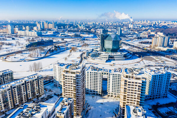 Minsk, Belarus - January 24, 2019: Bright winter day begins in Minsk city, aerial cityscape