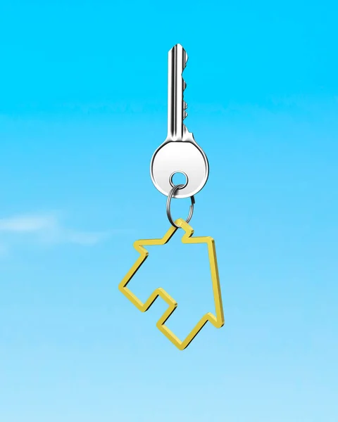 Silver key with golden house shape keyring, blue sky — Stock Photo, Image