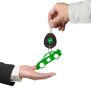 Anahtarlık el vermek elektrikli otomobil anahtar spor araba yeşil yaprakları.