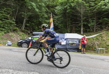 Mont du Chat, France - July 9, 2017: The Colombian cyclists Esteban Chaves of Team Orica-Scott climbing the road on Mont du Chat during the stage 9 of Tour de France 2017.  clipart