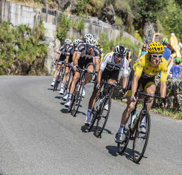  Pont-de-Montvert-Sud-Mont-Lozere, France - July 21, 2018: Geraint Thomas of Team Sky, in Yellow Jersey, in front of the peloton descending a road in Occitan region during the stage 14 of Tour de France 2018.