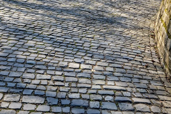 Detail of the famous cobblestone road Muur van Geraardsbergen located in Belgium. On this road every year is organized the famous one day road cycling race Tour of Flanders.