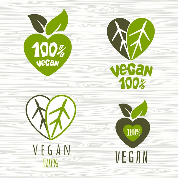 Vegano cien por ciento logotipo fresco vegetariano orgánico signo verde corazón hoja hojas elemento de diseño para pegatinas, etiquetas de productos. Ilustración vectorial dibujada a mano . — Vector de stock