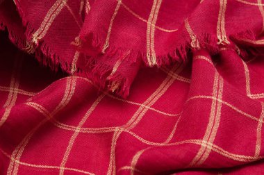 İskoç tartan deseni. Arka plan olarak kırmızı ekose baskı. Renkli çizgiler ve kare desen. İskoç kontrol kumaş.