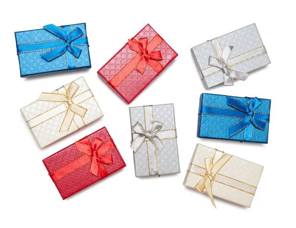 彩色五颜六色的箱子与礼物捆绑的弓查出在白色背景 — 图库照片