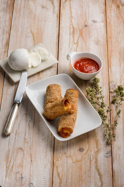 Breaded ragout cannelloni with tomato sauce mozzarella and orega — Stock Photo, Image