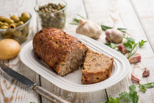 Meatloaf with potatoes and parsley — Stock Photo, Image