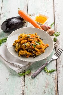 chicken stewed with eggpalnts carrots basil and turmeric spice