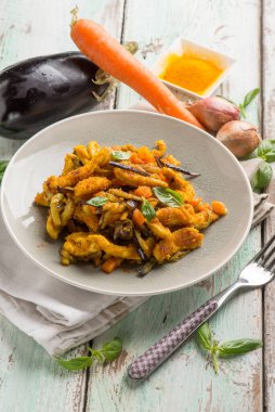 chicken stewed with eggpalnts carrots basil and turmeric spice