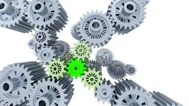 Kamera yavaş hareket birçok gri ve yeşil büyük vites beyaz bir arka plan ile sağ sol üstten görünüm