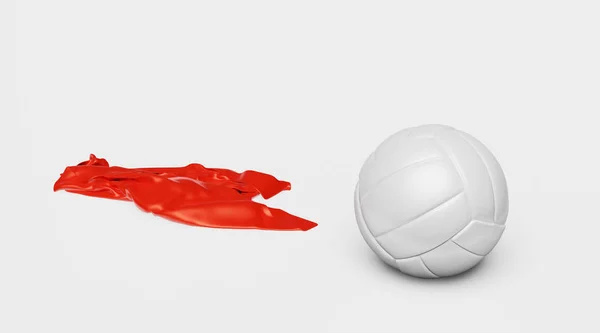 Una pallavolo con un pezzo di tessuto rosso a sinistra — Foto Stock