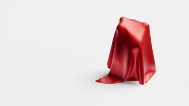 Red shiny fabric piece which hidden Bowling Bronze Trophy and discovering it with a white background