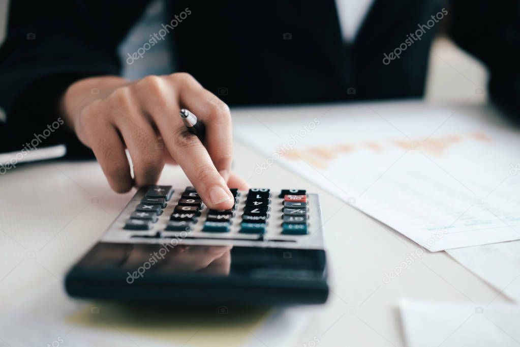 Finances Saving Economy concept. Accountant or banker calculate the cash bill.