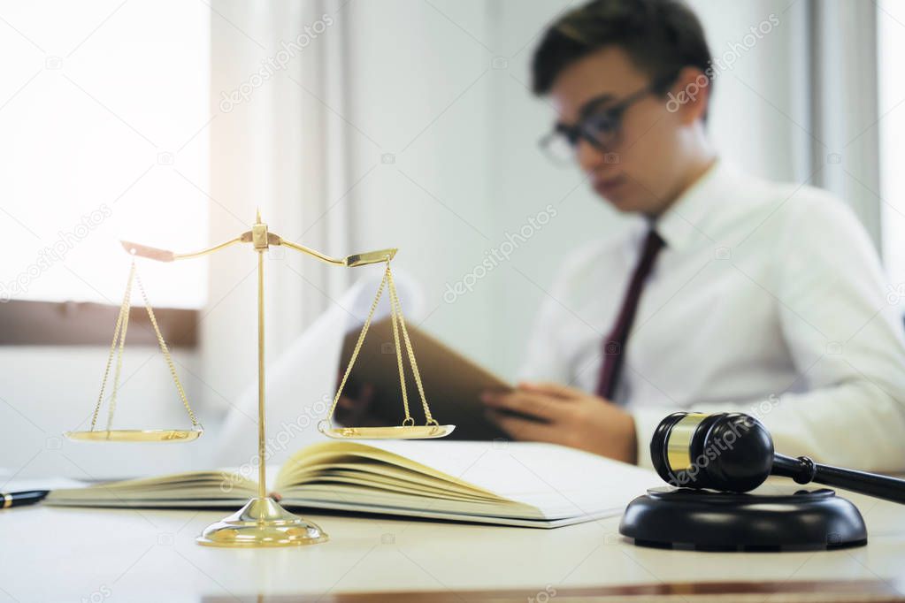 Young lawyer business man working with paperwork on his desk in office