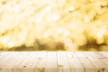 Ahşap masa bokeh arka plan üzerinde üst ve montaj veya görüntü ürünleri için kullanılan.