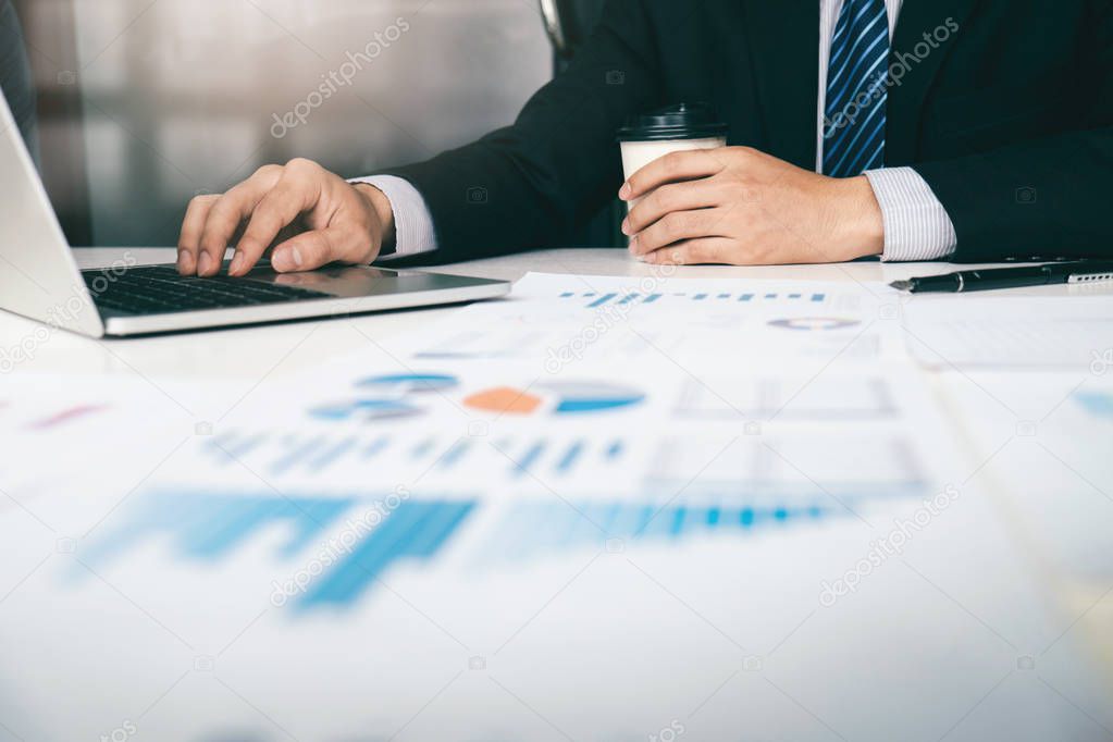 Businessman planning and analyse investment marketing data.