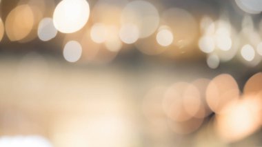 Abstract blurred bokeh light with warm tone color background con