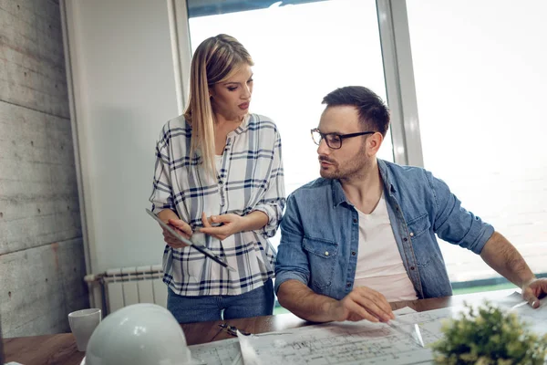 Young Architect Colleagues Analyzing Blueprints Office — Stock Photo, Image