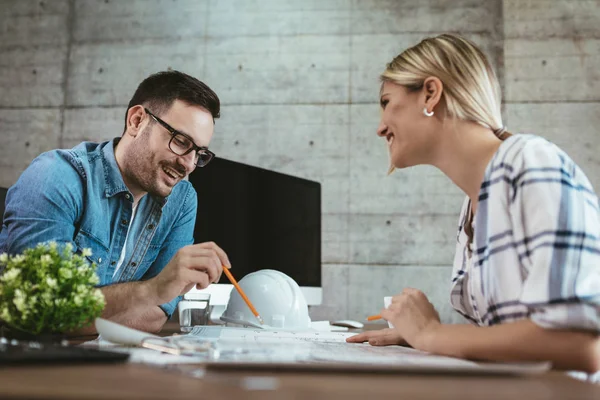 Young Architect Colleagues Analyzing Blueprints Office — Stock Photo, Image