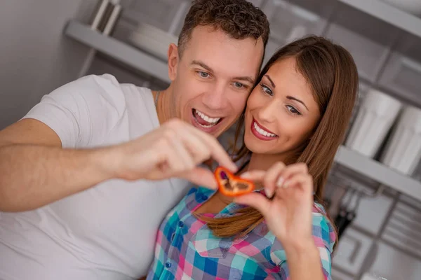 Happy Young Couple Holding Slice Red Paprika Heart Shape — Stock Photo, Image