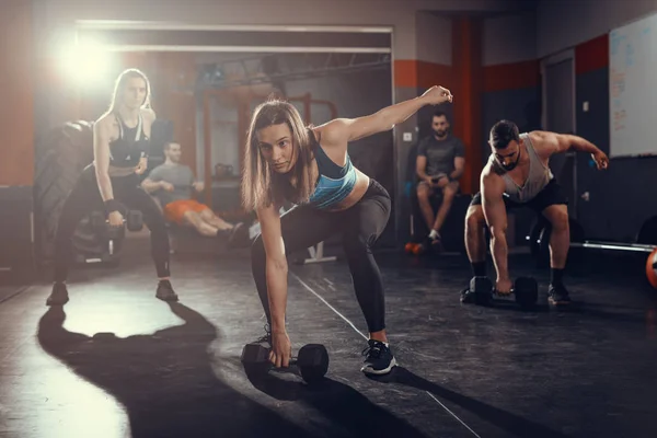 Young Friends Doing Hard Exercise Dumbbell Gym — Stock Photo, Image