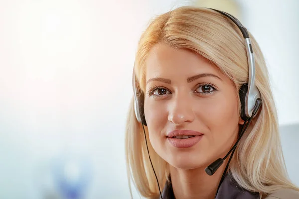 portrait young blonde woman with headset on head