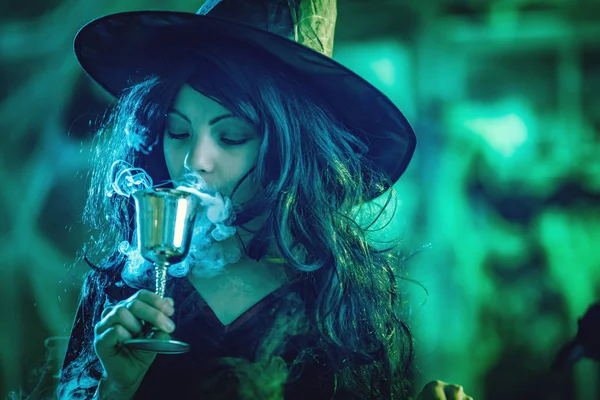 Young Witch Serious Face Holding Goblet Drinking Magic Potion — Stock Photo, Image