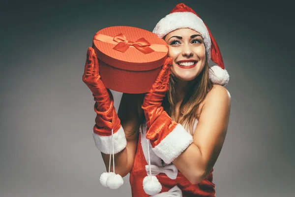 Young Smiling Woman Santa Claus Costume Holding Red Gift Box — Stock Photo, Image