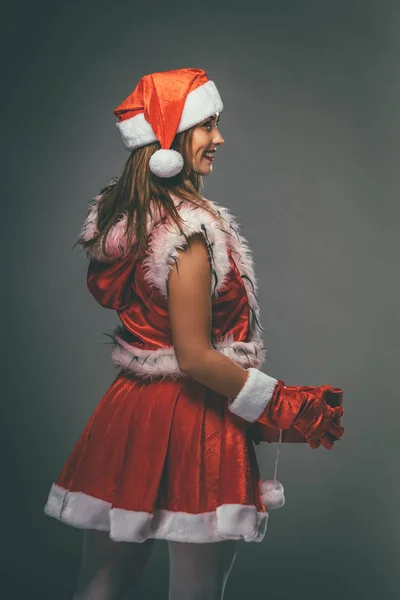 Young Smiling Woman Santa Claus Costume Holding Red Present — Stock Photo, Image