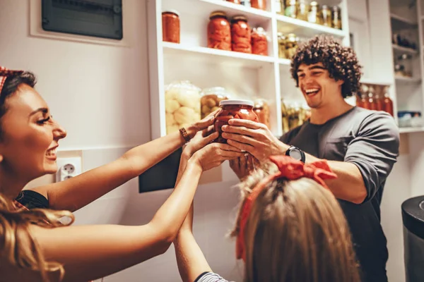 Happy Family Taking Jars Pickled Vegetables Pantry Shelf — Stock Photo, Image