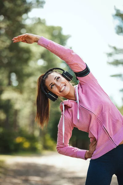 Happy Woman Stylish Sportswear Stretching Sunny Forest — Stock Photo, Image