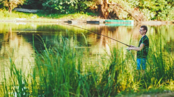 Young Man Fishing Coast Freshwater Lake Fringed Lush Scenery — Stockfoto