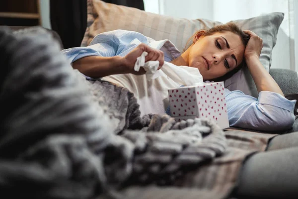 Young Woman Lying Sick Home Couch Taking Paper Handkerchief Blowing — Stock Photo, Image