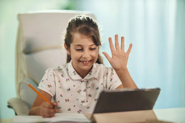 Shot Cute Little Girl Using Her Tablet Online Lesson Waving — Stock Photo, Image