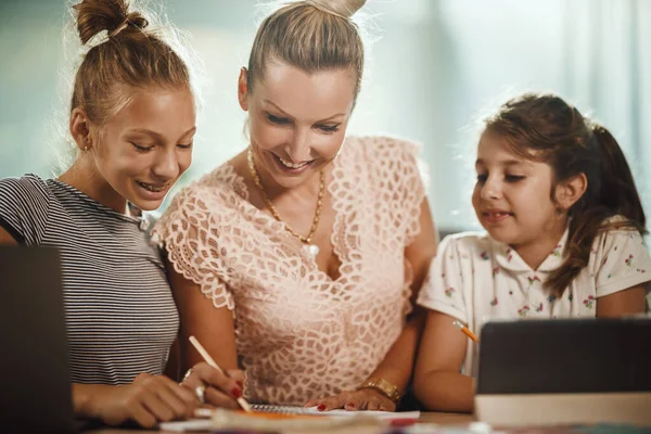 Shot Beautiful Young Mother Helping Hers Two Daughters Homework Covid — Stock Photo, Image