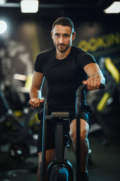 Young Muscular Man Doing Hard Cal Bike Crossfit Training Gym — Stock Photo, Image