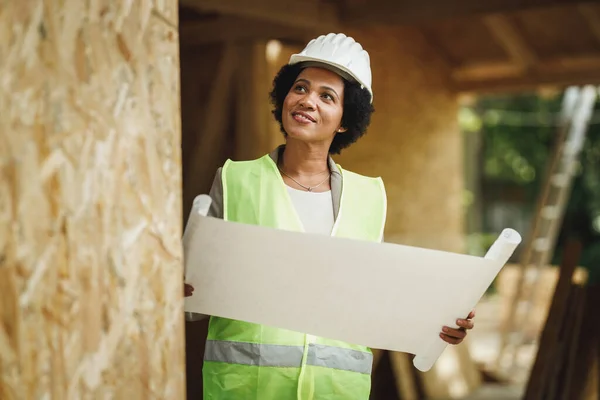 Shot African Female Architect Checking Blueprints Construction Site New Wooden — Stock Photo, Image