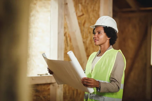 Shot African Female Architect Checking Blueprints Construction Site New Wooden — Stock Photo, Image