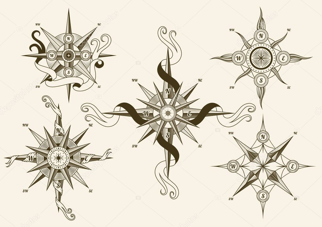 Collection of vintage nautical compass. Old vector design elements for marine theme and heraldry. Hand drawn wind roses