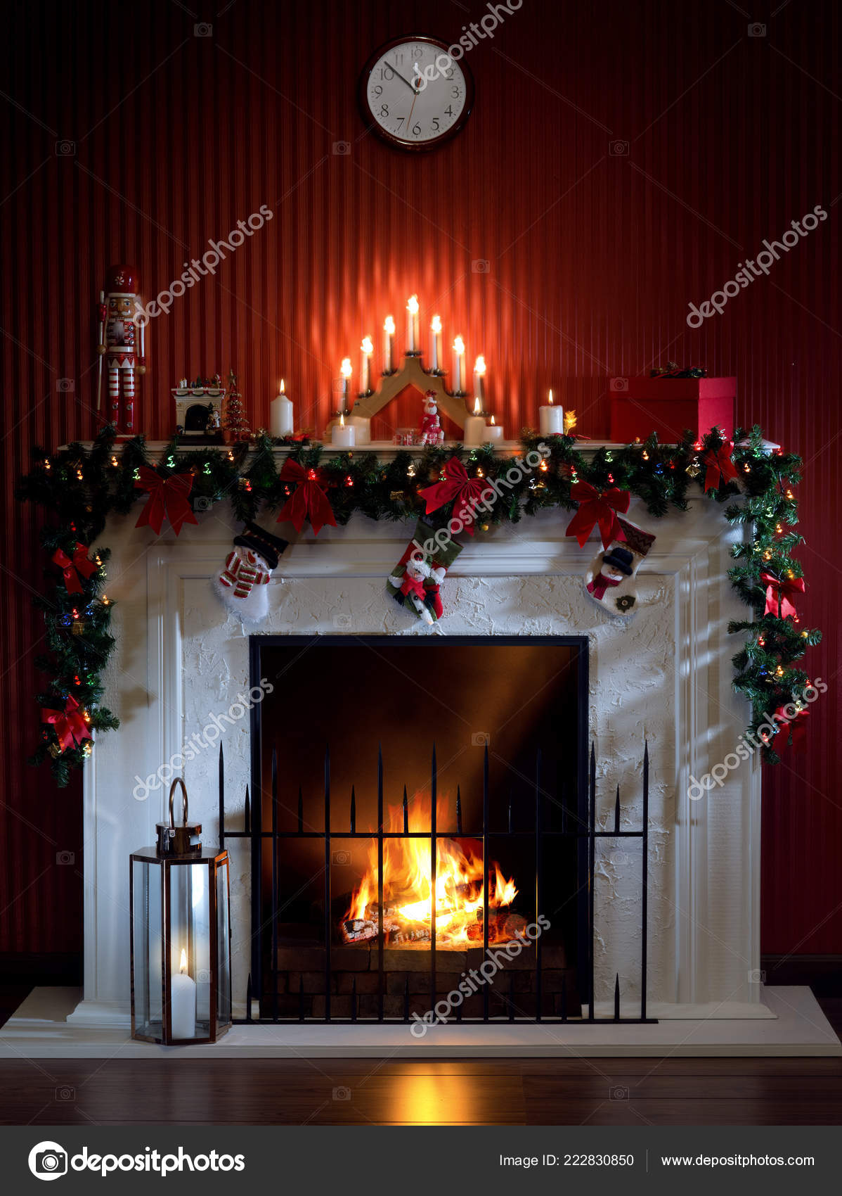 View Nice White Christmas Decorated Fireplace Candles Stock