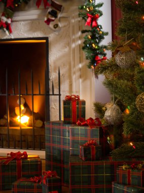 view of wrapped gifts and fireplace with christmas tree on the back clipart