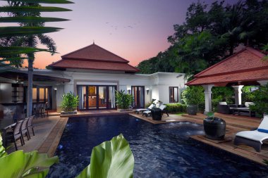 Tropik ortamda güzel bir bali tarzı villa manzarası   