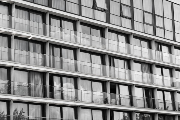 Glass facade - many glazed balconies, black & white