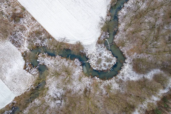 top view of the river and snowy fields