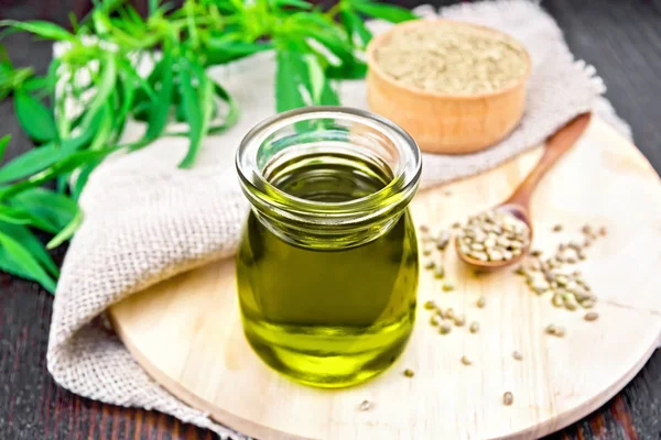 Hemp Oil Glass Jar Grain Spoon Flour Bowl Leaves Stalks — Stock Photo, Image