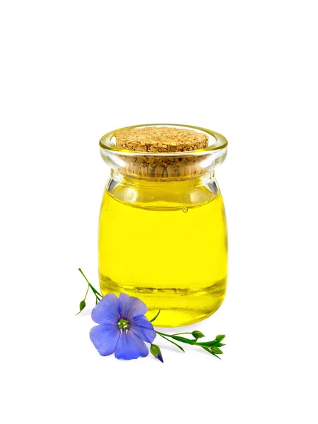 Oil linenseed in jar with flower — Stock Photo, Image