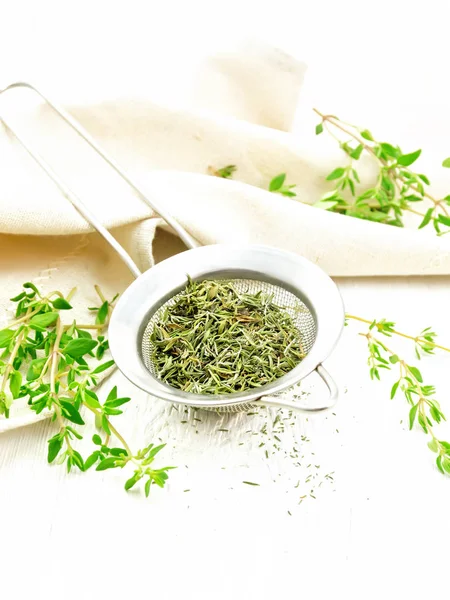 Thyme dry in strainer on light board — Stock Photo, Image