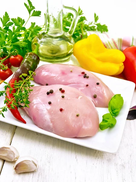 Chicken breast raw in plate on light board — Stock Photo, Image