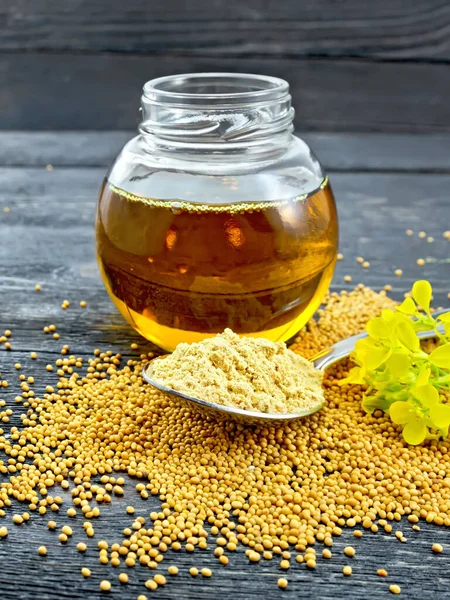 Mustard powder in spoon with oil on board — Stock Photo, Image