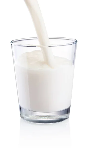 Pouring milk into glass isolated on white background — Stock Photo, Image
